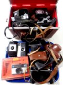 A leather camera bag and a tray containing a quantity of assorted cameras to include Kodak, Zenit,