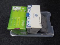 A boxed XBox 360 console together with a boxed Dreamcast console and a PlayStation (as found)