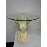 A contemporary glass topped occasional table on mermaid pedestal
