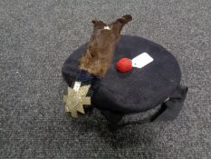 A Scottish Highlanders beret with badge and plume