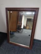 A framed bevel edged mirror