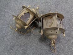 A pair of eastern hanging brass lanterns
