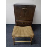 A 20th century John Carter double door record cabinet together with a gold Lloyd Loom dressing