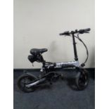 A Lankeleisi G100 folding e-bike with keys,