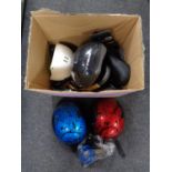 A box containing cycle helmets and bicycle accessories