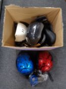 A box containing cycle helmets and bicycle accessories