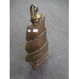 An antique cast iron companion stand with companion pieces in the form of a galleon