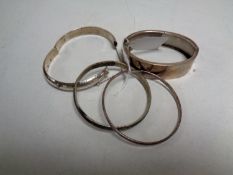 Four silver bangles