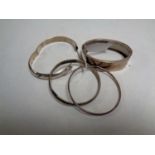 Four silver bangles