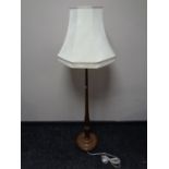 A beech standard lamp with shade