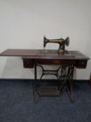 A Singer treadle sewing machine in table