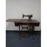 A Singer treadle sewing machine in table