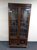 An early 20th century oak double door bookcase with leaded glass doors (as found)