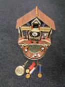 A Bradford Editions The Faithful Fuzzies Mighty Marines novelty cuckoo clock with pendulum and