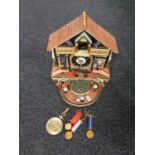 A Bradford Editions The Faithful Fuzzies Mighty Marines novelty cuckoo clock with pendulum and