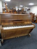 A walnut cased over strung piano by Challen