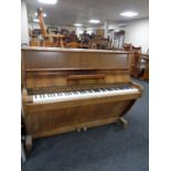 A walnut cased over strung piano by Challen