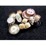 A tray containing antique tea ware to include copper lustre teacups and milk jug,