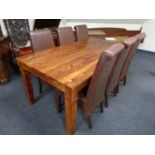 A contemporary extending dining table with leaf together with a set of six high backed brown