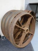 A set of four cast iron cart wheels