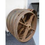 A set of four cast iron cart wheels