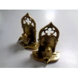 A pair of heavy brass bookends with busts of Victor Hugo