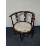 An early 20th century beech oval elbow chair