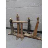 A set of grand piano foot pedals together with four grand piano legs,