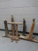 A set of grand piano foot pedals together with four grand piano legs,
