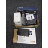 A box containing assorted electricals to include an Ericsson vehicle hands free kit, router,