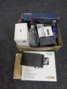 A box containing assorted electricals to include an Ericsson vehicle hands free kit, router,