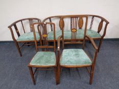 An Edwardian open tub chair with matching settee,