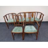 An Edwardian open tub chair with matching settee,