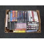 A box containing guitar instruction video cassettes