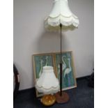 A 1970s teak and brass standard lamp with shade,