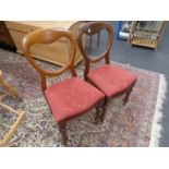 A pair of Victorian mahogany balloon back chairs