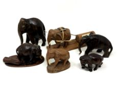 A small collection of carved wooden elephant ornaments
