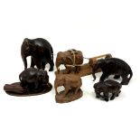 A small collection of carved wooden elephant ornaments