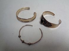 Three silver bangles