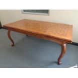 A heavy quality reproduction pull out dining table