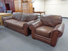 A three seater brown leather settee with matching armchair