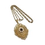 A 9ct gold pendant locket suspended upon a 9ct gold chain, set with pearls and a garnet,