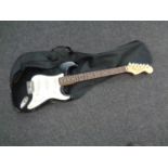 A Liberty 303 Stratocaster style electric guitar in soft carry case together with a further empty