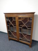 An early 20th century mahogany glazed bookcase