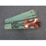 An early 20th century violin with 14" two-piece back, unlabelled, with later bow,