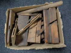 A box containing a large quantity of woodworking planes
