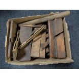 A box containing a large quantity of woodworking planes