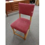 An oak chair upholstered in burgandy fabric