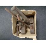 A box containing antique wood planes