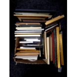 A box containing a large quantity of assorted picture frames, mirrored frames, prints,